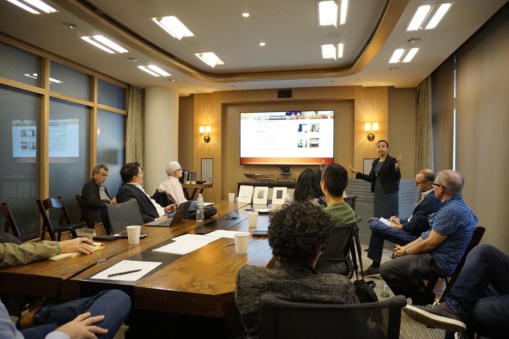 Norstone AIA live class in an architecture firm conference room with a presenter and handful of architects attending the session